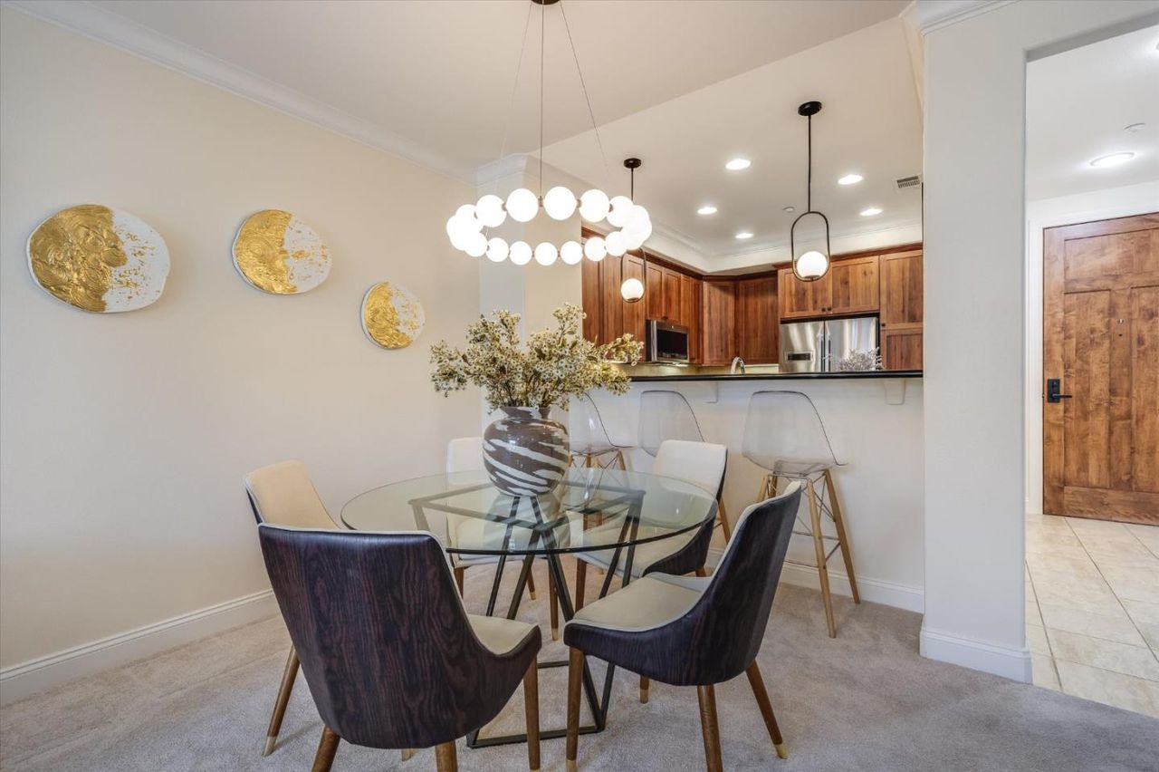 Dining table by the kitchen bar at 2881 Meridian Ave Unit 249