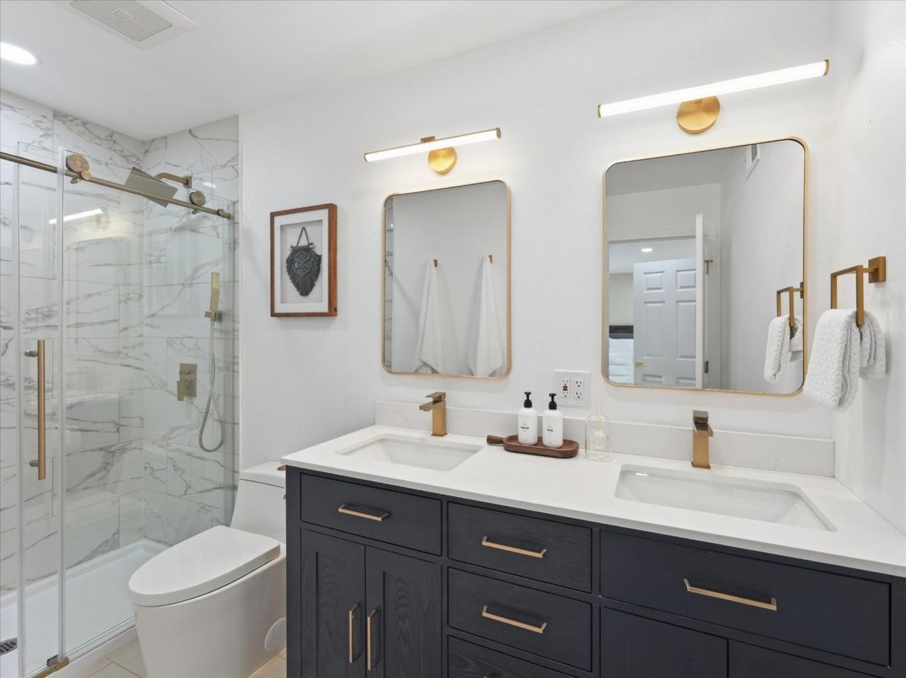 Updated bath with double sinks at 4999 Massachusetts Dr