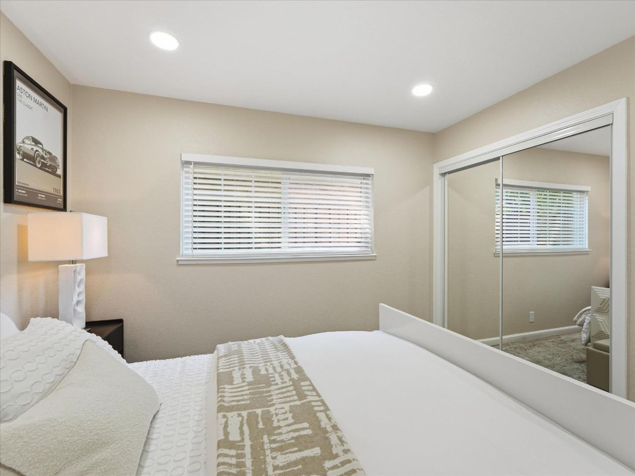 Calm bedroom with mirrored closets at 4999 Massachusetts Dr