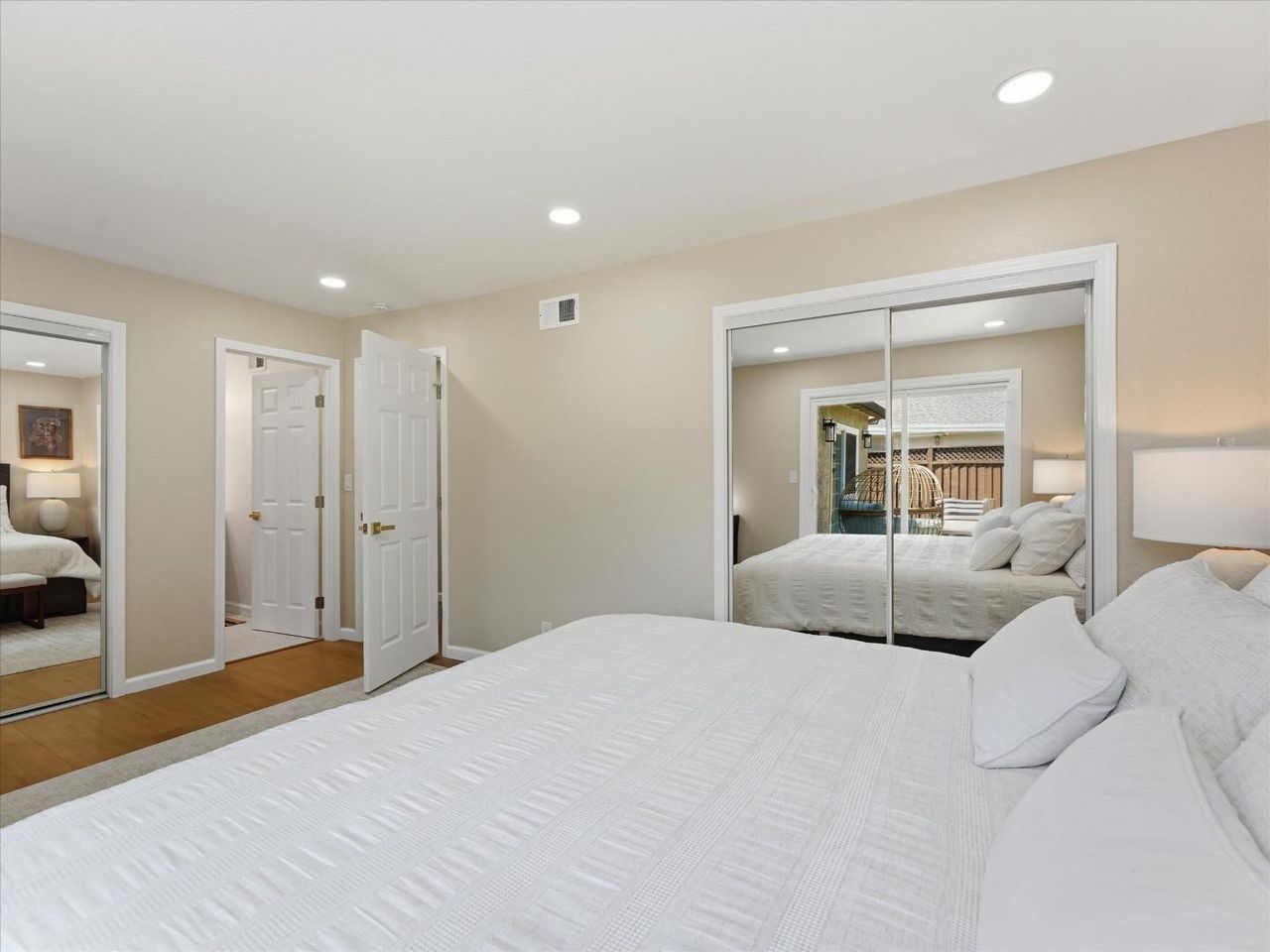 Bedroom with mirrored closets at 4999 Massachusetts Dr