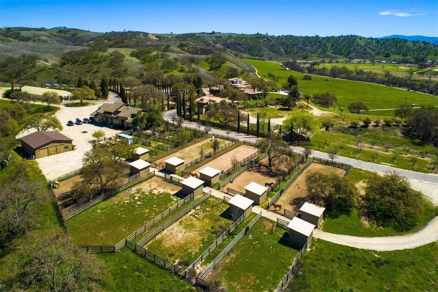 Representative Hidden Valley horse ranch with fenced paddocks and hills