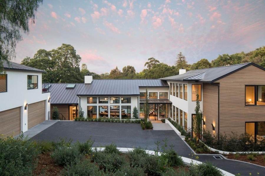 Representative modern Skywood Skyline farmhouse-style home at dusk